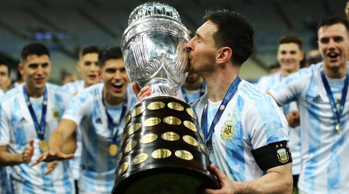 Lionel Messi kissing the Copa America.